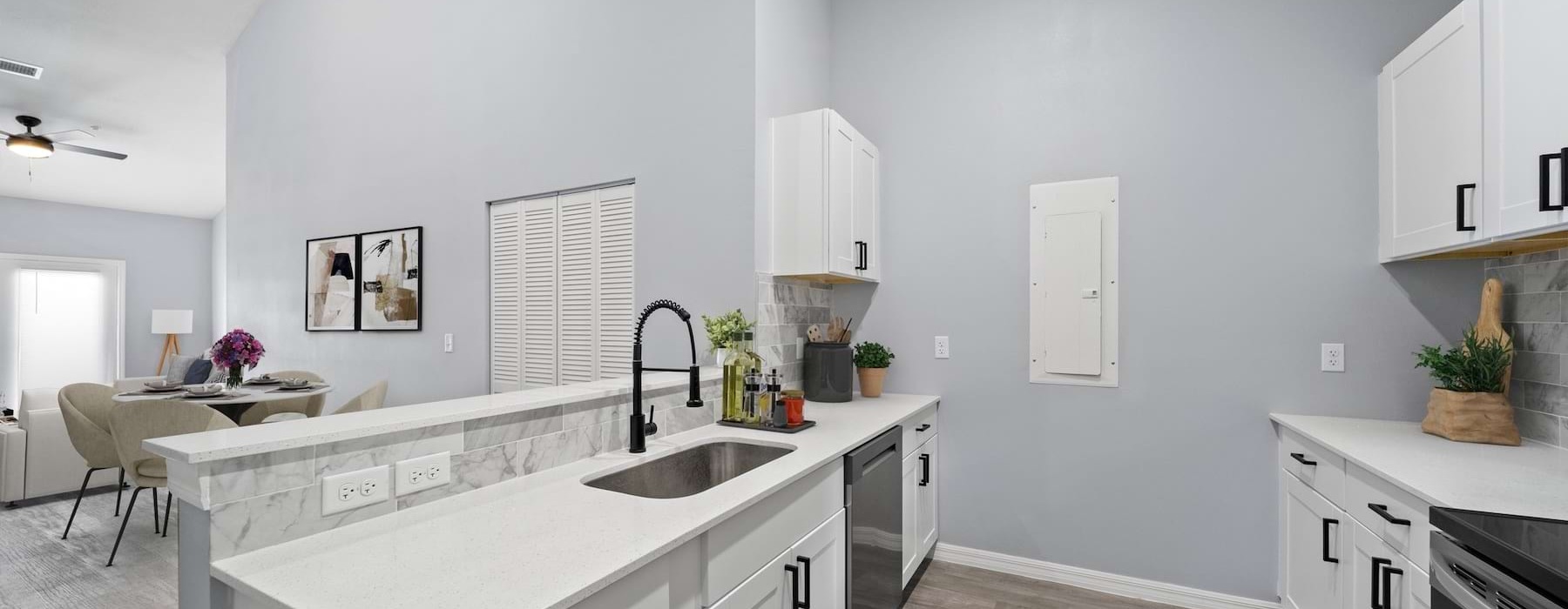 a kitchen with white cabinets