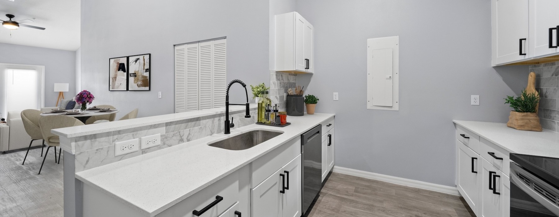 a kitchen with white cabinets